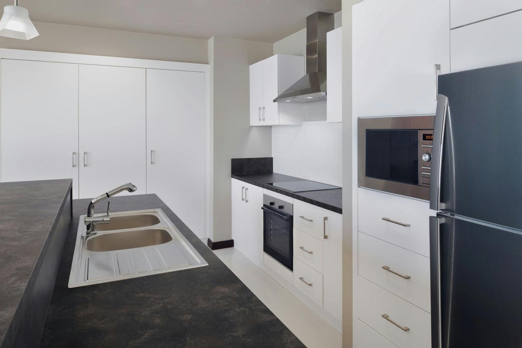 Delta Hotels By Marriott City Center Doha Exterior photo A typical kitchen in a student apartment