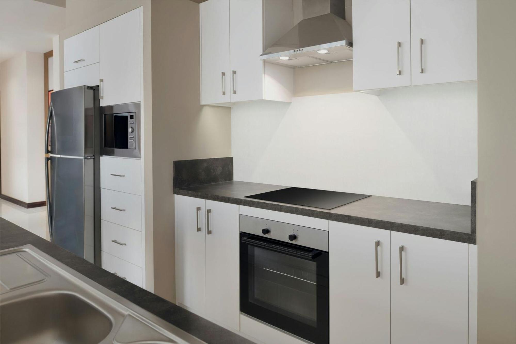 Delta Hotels By Marriott City Center Doha Exterior photo A typical kitchen in a student apartment